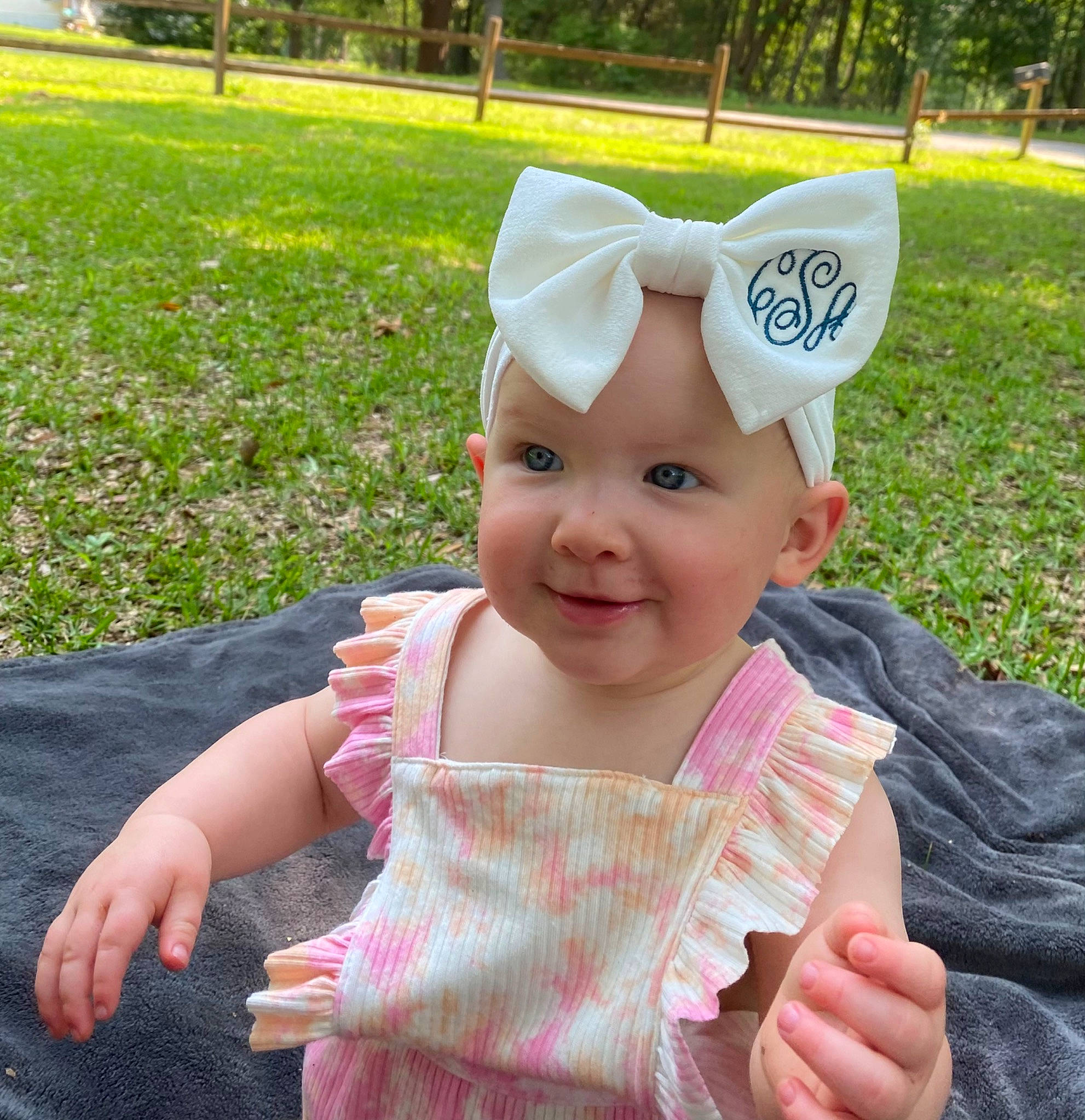 Caylee is registered to the contest to win money with this photo: baby, baby_toddler_clothing, cap, child, costume_hat, finger, fun, gesture, grass, green, happy, hat, headwear, joy, person, photograph, pink, plant, skin, smile