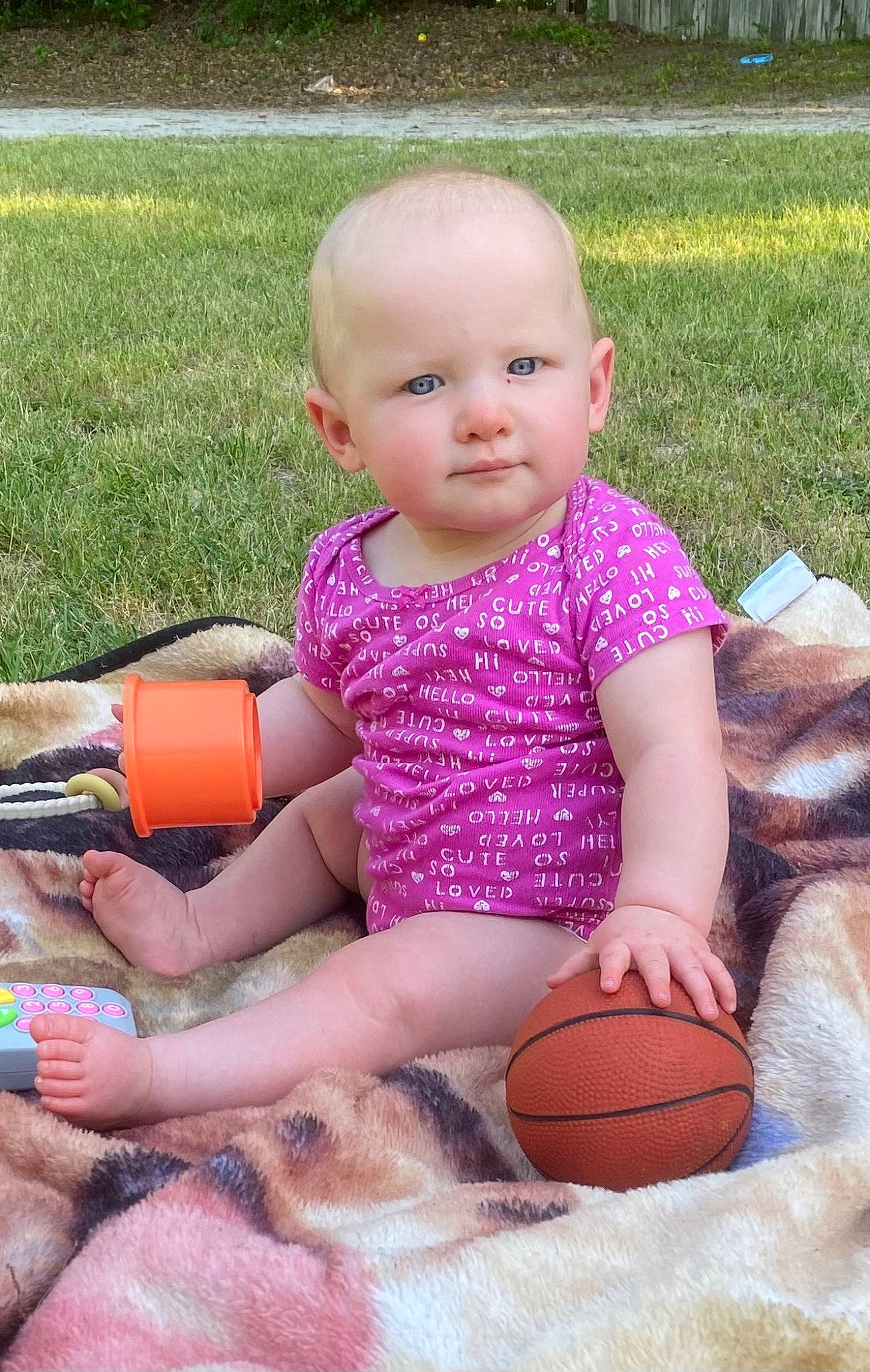 Caylee is registered to the contest to win money with this photo: baby, baby_toddler_clothing, ball, child, eye, face, finger, fun, grass, hand, happy, human_body, leg, leisure, people_in_nature, person, pink, shorts, skin, thigh