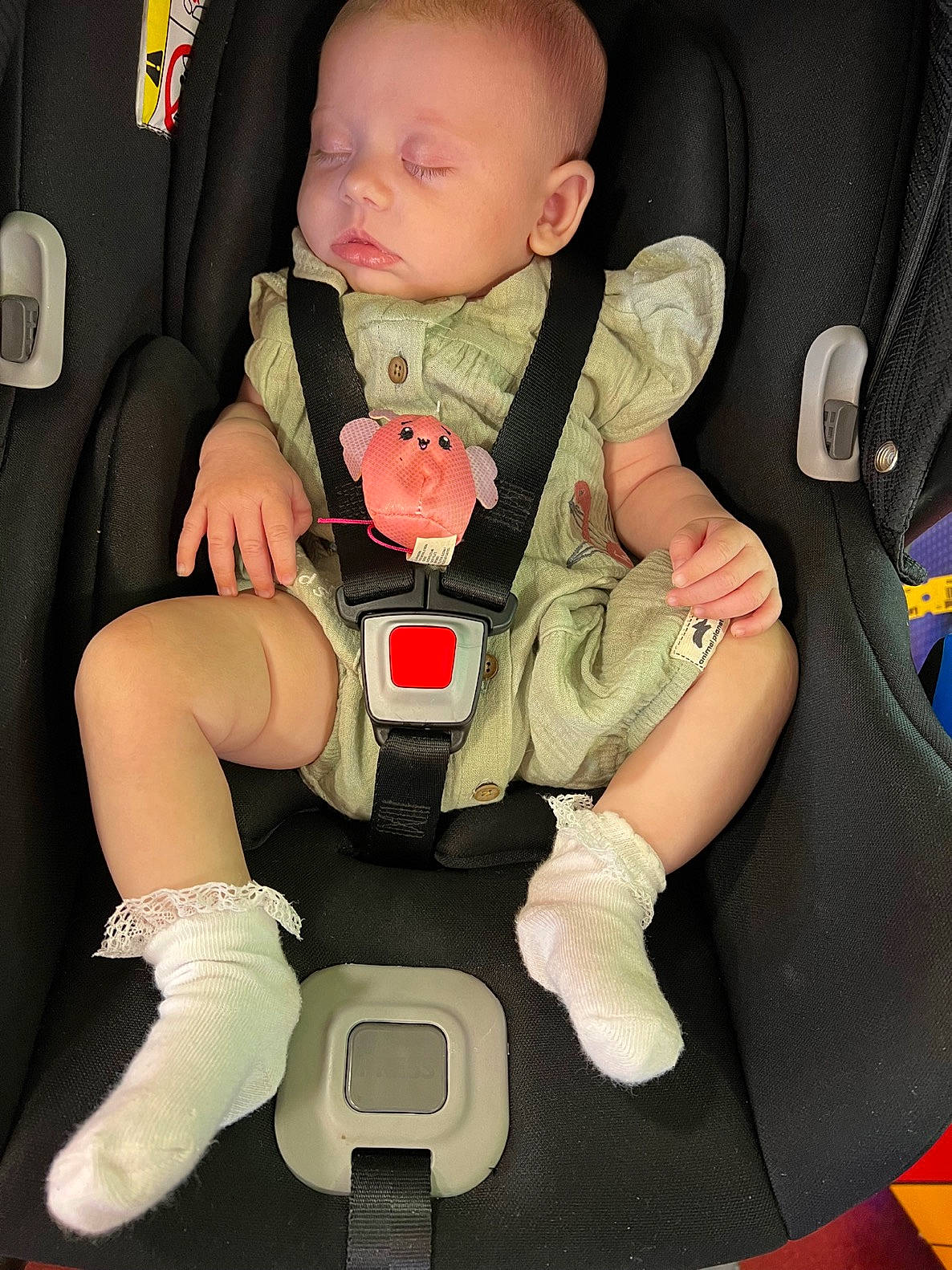 Eliza is registered to the contest to win money with this photo: arm, auto_part, baby, baby_carriage, baby_in_car_seat, baby_products, baby_toddler_clothing, car_seat, child, comfort, finger, human_body, lap, leg, person, personal_protective_equipment, product, seat_belt, sitting, thigh