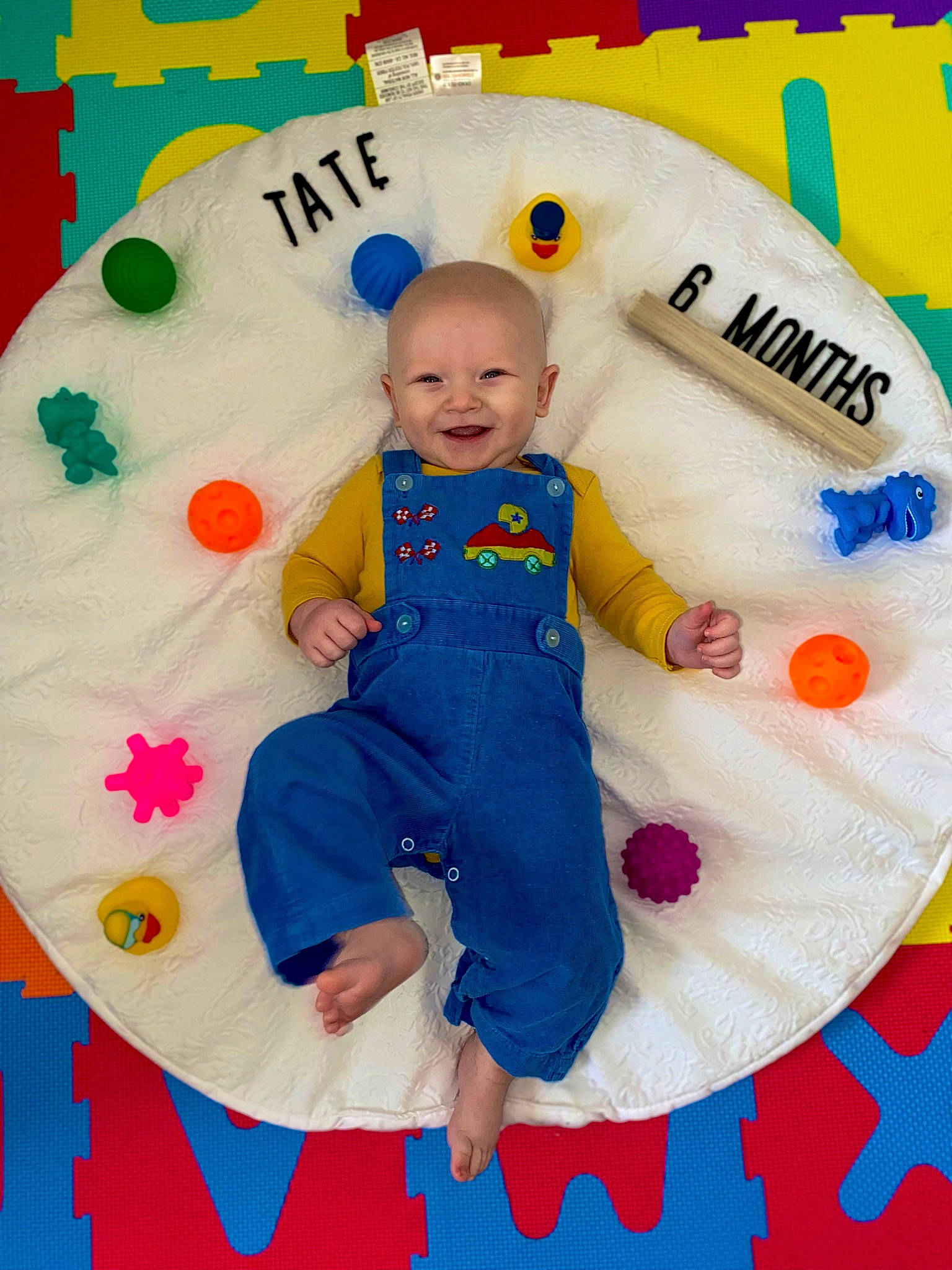 Tate joined the competition — help win amazing prizes! art, baby, baby_products, baby_toddler_clothing, baby_toys, child, circle, event, fun, happy, joy, pattern, person, pink, play, product, sitting, sleeve, smile, t_shirt