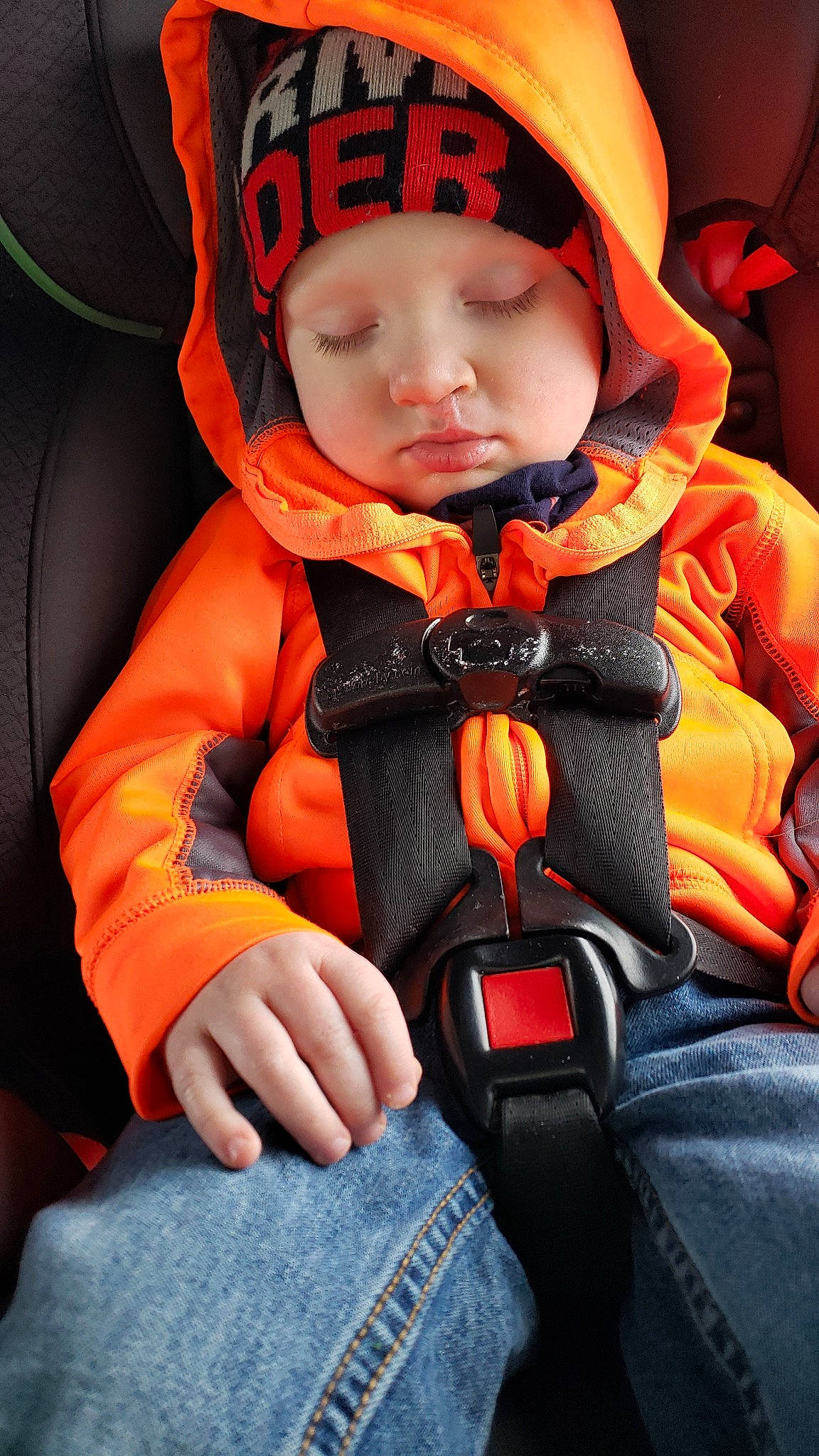 Bryce joined the competition — help win amazing prizes! auto_part, baby, baby_in_car_seat, car_seat, child, orange, person, seat_belt, toddler