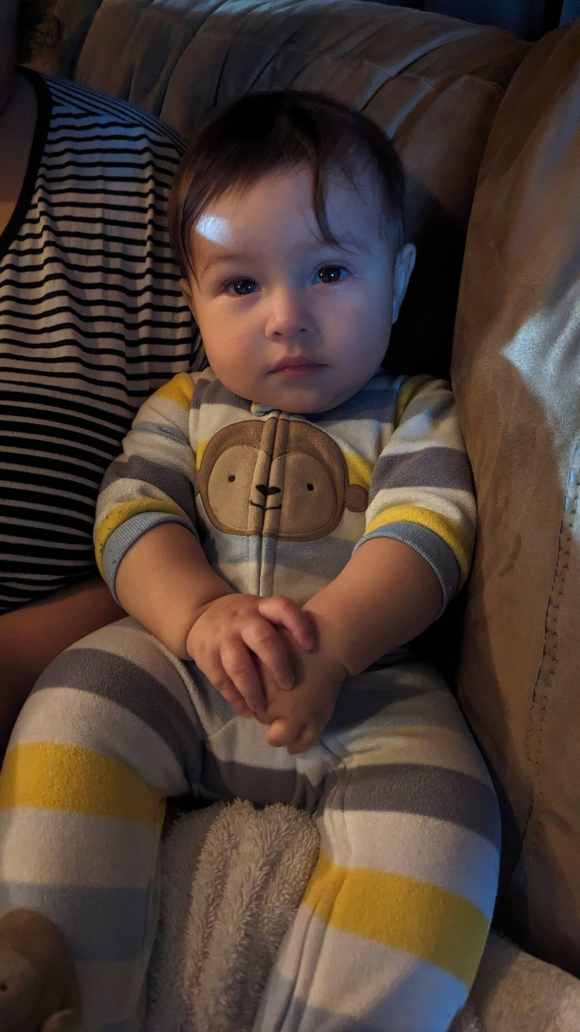 Brandon is registered to the contest to win money with this photo: baby, baby_toddler_clothing, blond, cheek, comfort, finger, hand, human_leg, iris, knee, leg, mammal, nose, person, shoulder, sitting, skin, t_shirt, thigh, toddler