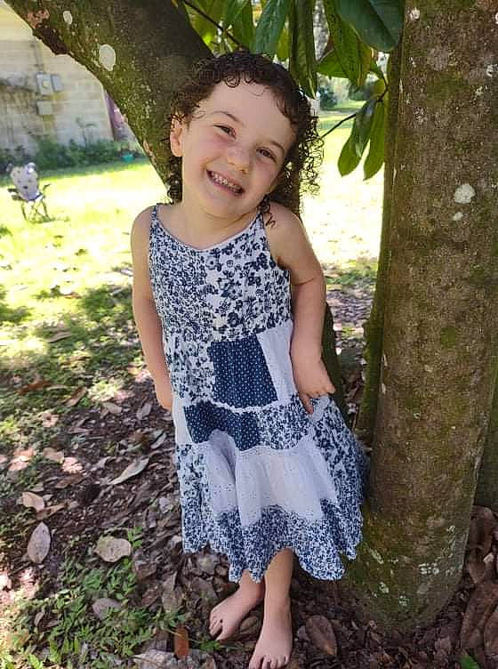 Ruby joined the competition — help win amazing prizes! adaptation, baby_toddler_clothing, botany, day_dress, eye, face, grass, happy, head, iris, joy, natural_environment, nature, one_piece_garment, people_in_nature, person, plant, sleeve, smile, toddler