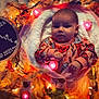 baby, blanket, autumn_leaves, lights, infant, face, person, cozy, milestone, cute, pink_light, decor, fall, orange_clothing, portrait, celebration, warm, soft_texture, baby_girl, november