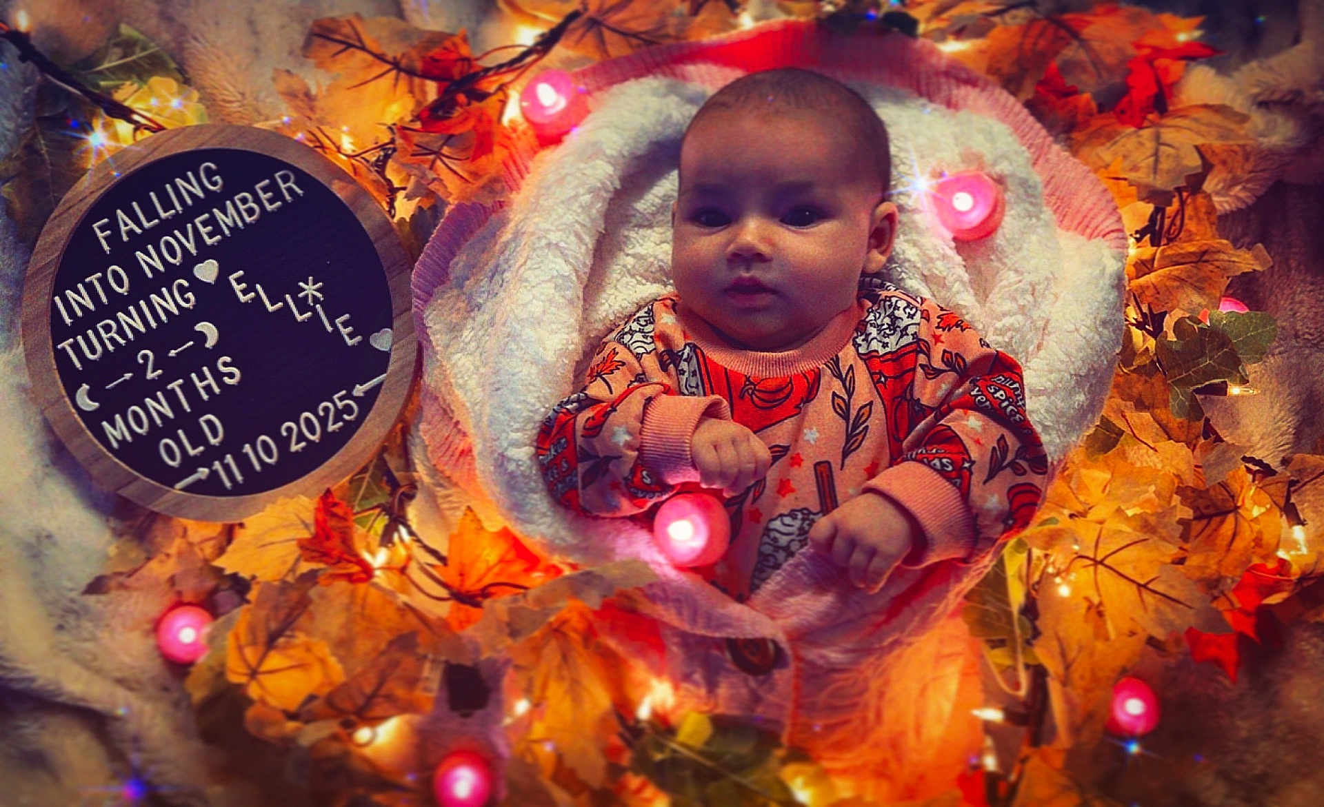 Ellie is registered to the contest to win money with this photo: baby, blanket, autumn_leaves, lights, infant, face, person, cozy, milestone, cute, pink_light, decor, fall, orange_clothing, portrait, celebration, warm, soft_texture, baby_girl, november