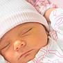 baby, child, close_up, clothing, cute, face, hat, headwear, infant, newborn, peaceful, pink, portrait, rest, skin, sleep, sleeping, soft, toddler, white