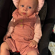 Paula participe au concours pour gagner de l'argent avec cette photo : baby, infant, car_seat, pink_clothing, romper, striped_shirt, blue_eyes, soft_cushion, hand, legs, cute, child, indoors, portrait, seatbelt, clothing, person, skin, head, expression