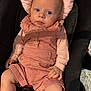 baby, infant, car_seat, pink_clothing, romper, striped_shirt, blue_eyes, soft_cushion, hand, legs, cute, child, indoors, portrait, seatbelt, clothing, person, skin, head, expression