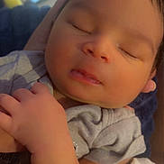 Josiah is registered to the contest to win money with this photo: baby, sleeping, infant, closeup, hand, soft_light, cozy, blanket, newborn, peaceful, face, portrait, cute, skin, clothing, resting, child, indoors, person, toddler