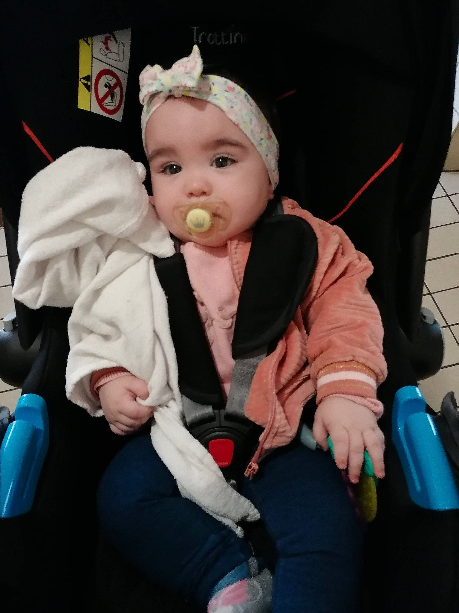 Mathilde participe au concours pour gagner de l'argent avec cette photo : baby, baby_products, baby_toddler_clothing, cap, cheek, child, comfort, costume, event, fashion_accessory, finger, fun, hat, headwear, jacket, lap, outerwear, person, sitting, skin