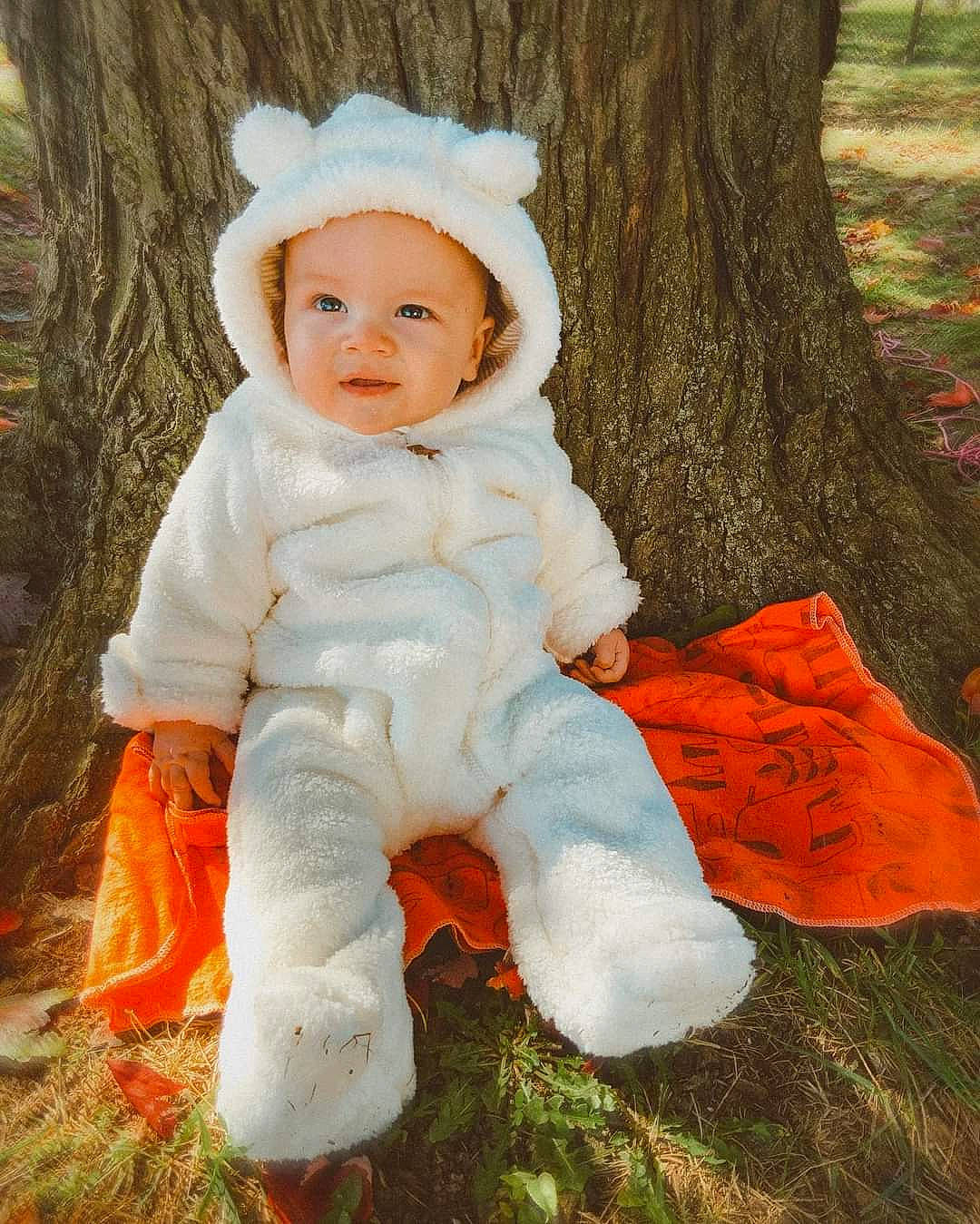Augustus joined the competition — help win amazing prizes! baby, baby_toddler_clothing, cap, child, fur, grass, happy, hat, human_body, people_in_nature, person, plant, portrait_photography, sitting, sleeve, smile, toddler, tree, trunk, wood