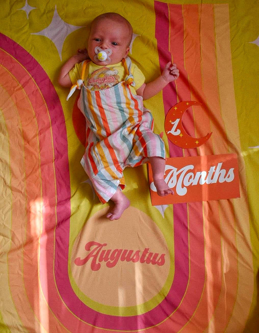 Augustus joined the competition — help win amazing prizes! baby, baby_toddler_clothing, child, doll, font, happy, linens, magenta, pattern, peach, person, pink, sleeve, textile, toddler, toy