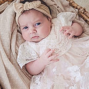 Arabella joined the competition — help win amazing prizes! baby, infant, headband, bow, lace, dress, basket, fabric, cloth, portrait, cute, child, newborn, person, face, hand, skin, indoor, soft, expression