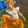 Kataleya participe au concours pour gagner de l'argent avec cette photo : child, girl, yellow_skirt, headband, smile, outdoor, grass, barefoot, white_top, playing, happy, sunlight, curly_hair, posing, summer, fashion, cute, joyful, fun, portrait