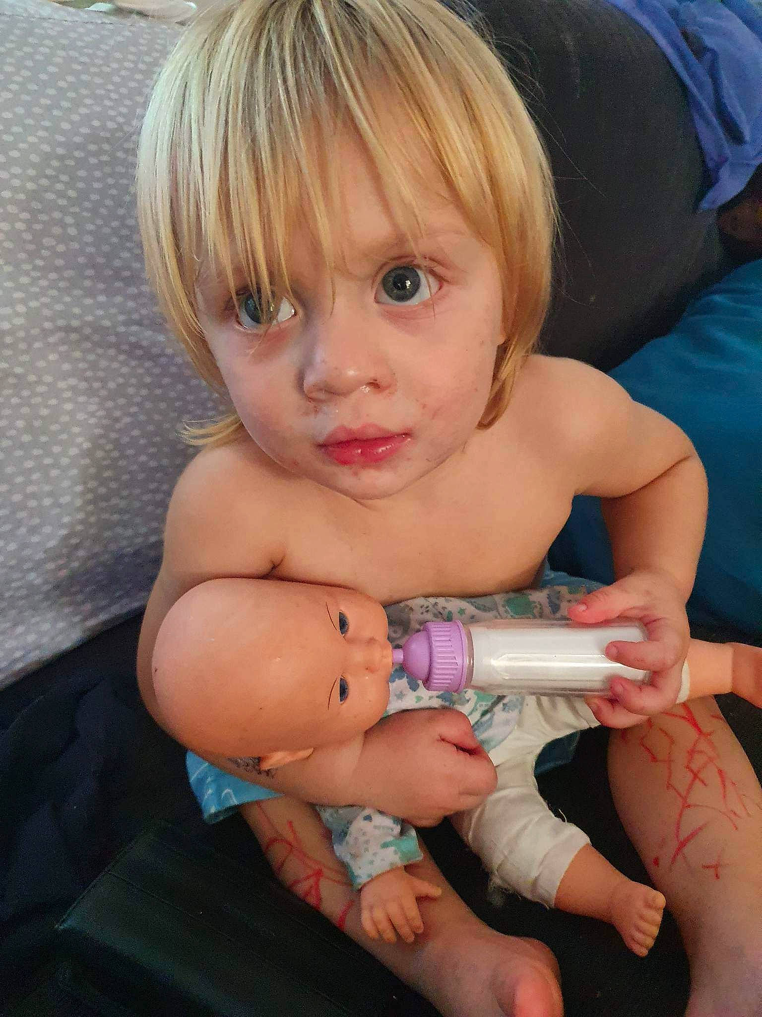 Jakob is registered to the contest to win money with this photo: baby, blond, cheek, chest, child, eyelash, face, gesture, human_body, human_leg, knee, lip, mouth, nail, person, product, skin, thigh, thumb, toddler