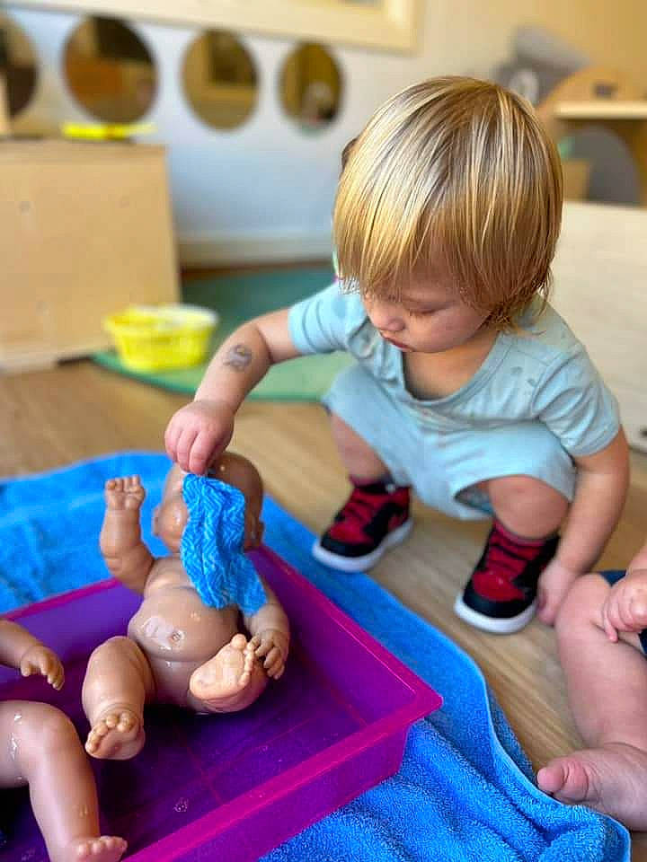 Jakob is registered to the contest to win money with this photo: animation, baby, baby_playing_with_toys, baby_toddler_clothing, baby_toys, child, finger, flooring, foot, fun, leisure, person, play, play_doh, room, sitting, sock, thumb, toddler, toy