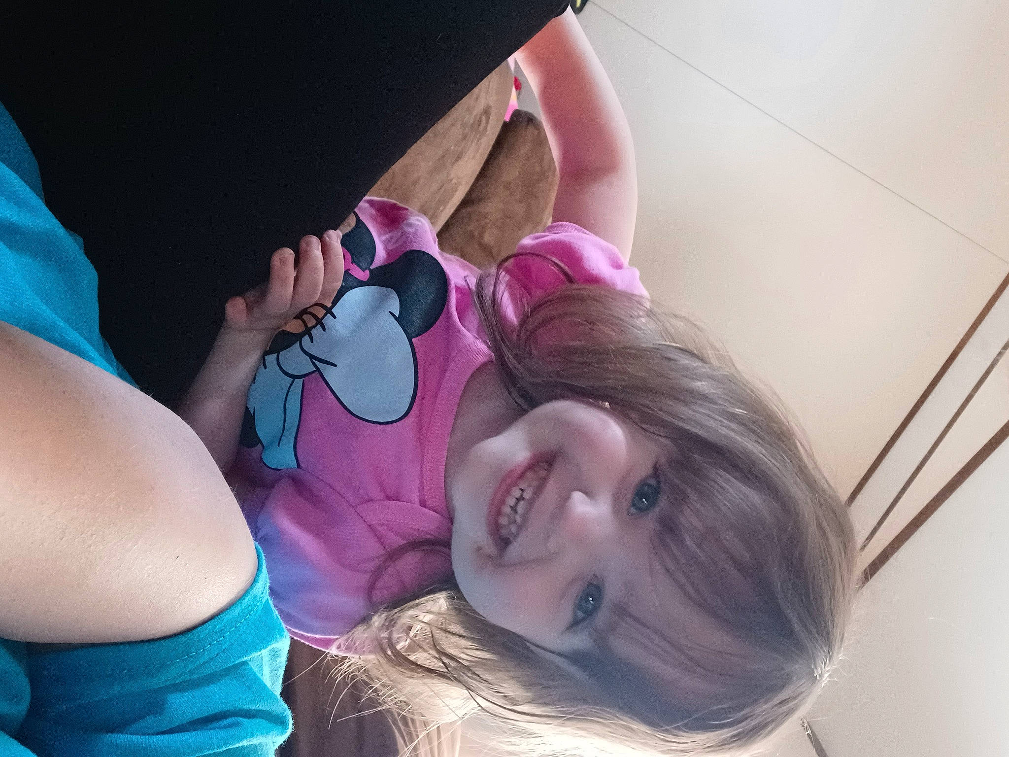 April is registered to the contest to win money with this photo: baby, ear, eye, eyelash, face, finger, gesture, hairstyle, happy, head, human_body, joint, joy, mouth, neck, organ, person, pink, purple, shoulder