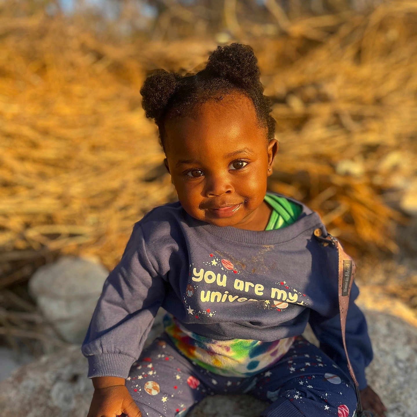 Avori is registered to the contest to win money with this photo: baby, babylaughing, blackhair, bodypart, clothing, coat, face, finger, hair, hand, happy, head, jacket, pants, person, photography, portrait, rock, sitting, smile