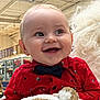 baby, child, smiling, red_shirt, bow_tie, indoor, holiday, decoration, reindeer, person, white_gloves, festive, happy, cute, face, portrait, holding, toy, christmas, celebration