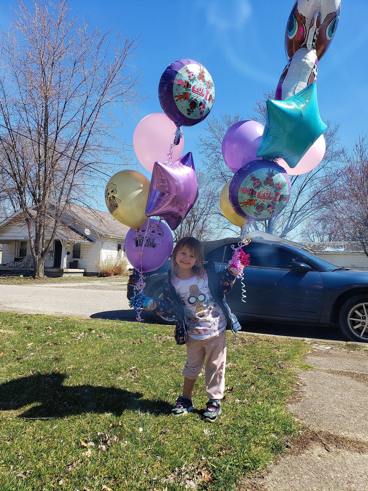 Laney is registered to the contest to win money with this photo: art, balloon, child, fun, games, joy, liquid_bubble, party_supply, person, purple, sculpture, sky, smile, tree, vacation, world