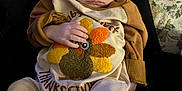 Andrew is registered to the contest to win money with this photo: baby, infant, sleeping, thanksgiving, turkey, clothing, hand, legs, carpet, lap, person, fabric, cozy, indoors, cute, child, soft, home, comfort, relaxing