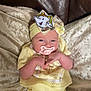Dolce-Mai joined the competition — help win amazing prizes! baby, pacifier, headband, yellow_clothing, knitwear, couch, cushion, infant, cute, indoors, relaxing, plush, small_hands, portrait, child, soft_texture, comfort, teapot_cartoon, seated, face