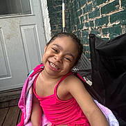 Armani joined the competition — help win amazing prizes! brick_wall, casual, chair, child, cute, door, girl, happy, joyful, outdoor, person, pink_swimsuit, playful, porch, seat, smiling, summer, towel, wooden_floor, young