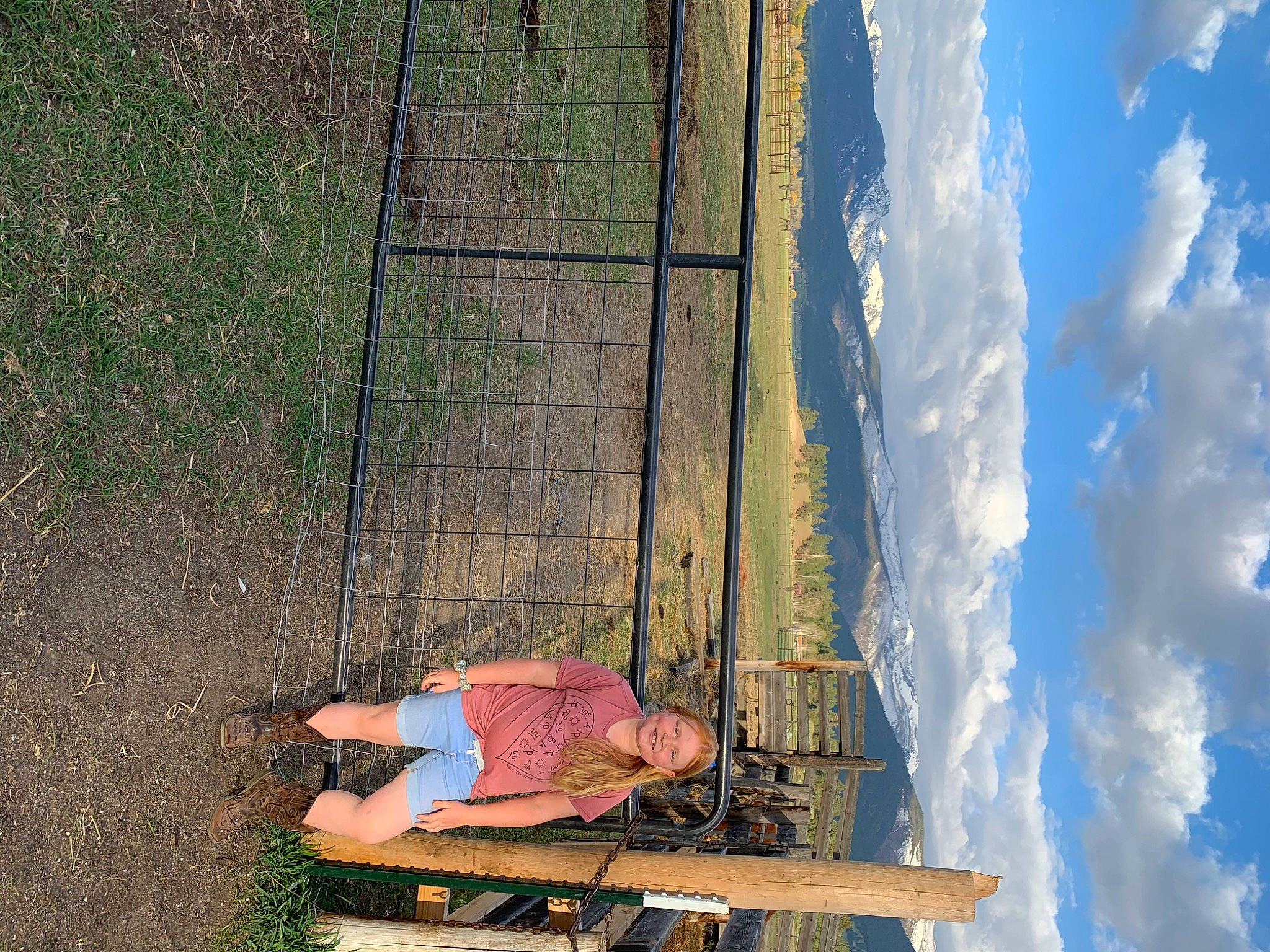 Brooke is registered to the contest to win money with this photo: cloud, cumulus, foot, fun, grass, grassland, human_leg, joy, landscape, leisure, morning, people_in_nature, person, plant, reflection, shadow, sitting, sky, tints_and_shades, tree