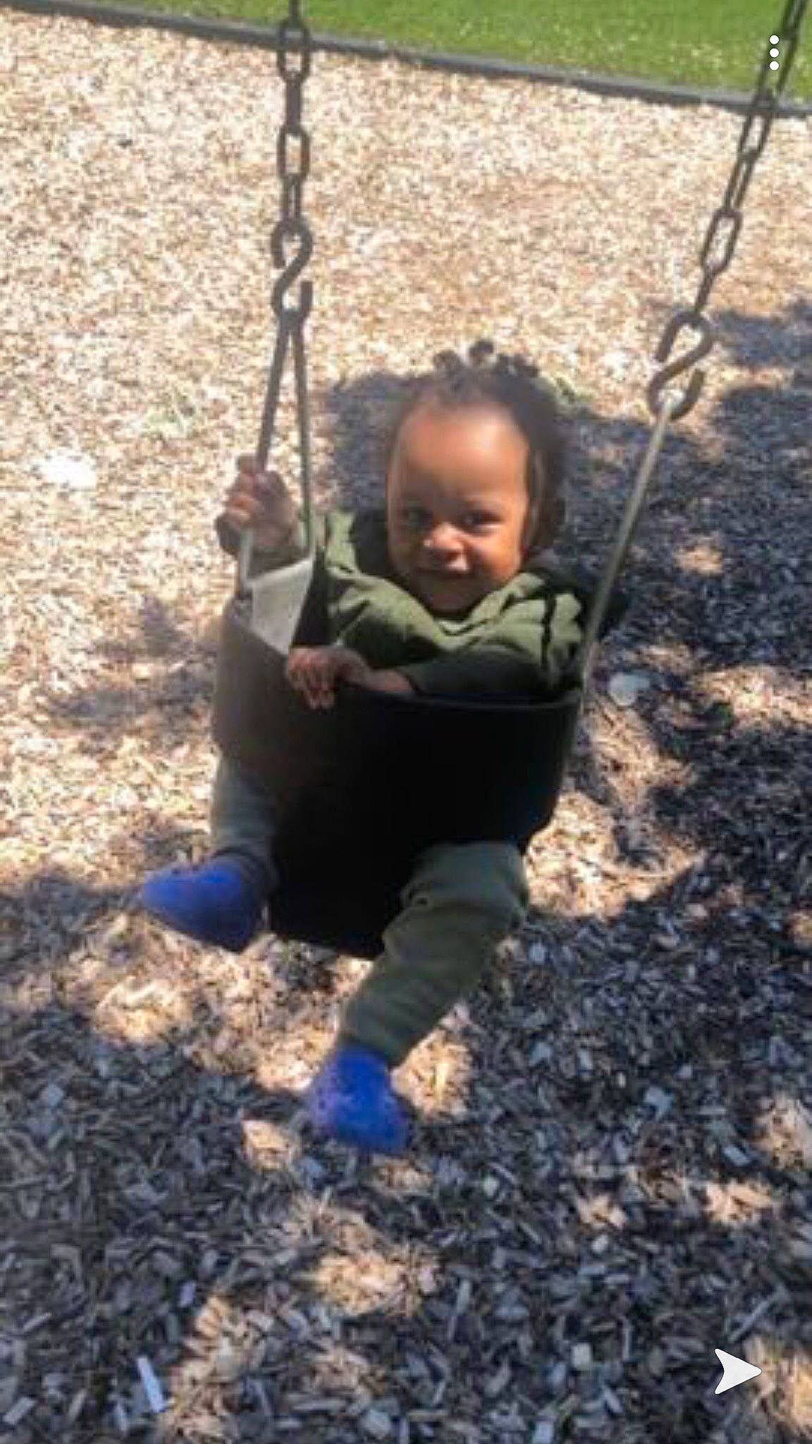 Jaylin is registered to the contest to win money with this photo: baby, balance, child, city, fun, human_settlement, outdoor_play_equipment, people_in_nature, person, play, playground, public_space, snapshot, summer, swing, toddler