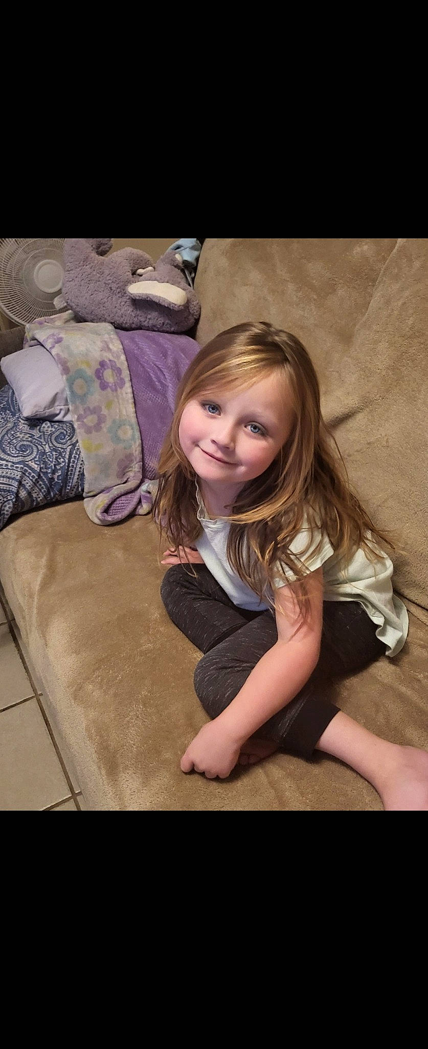 Paisley is registered to the contest to win money with this photo: blond, brown_hair, comfort, face, flash_photography, floor, flooring, fun, grass, happy, hardwood, human_leg, joy, knee, leisure, long_hair, person, sitting, smile, thigh