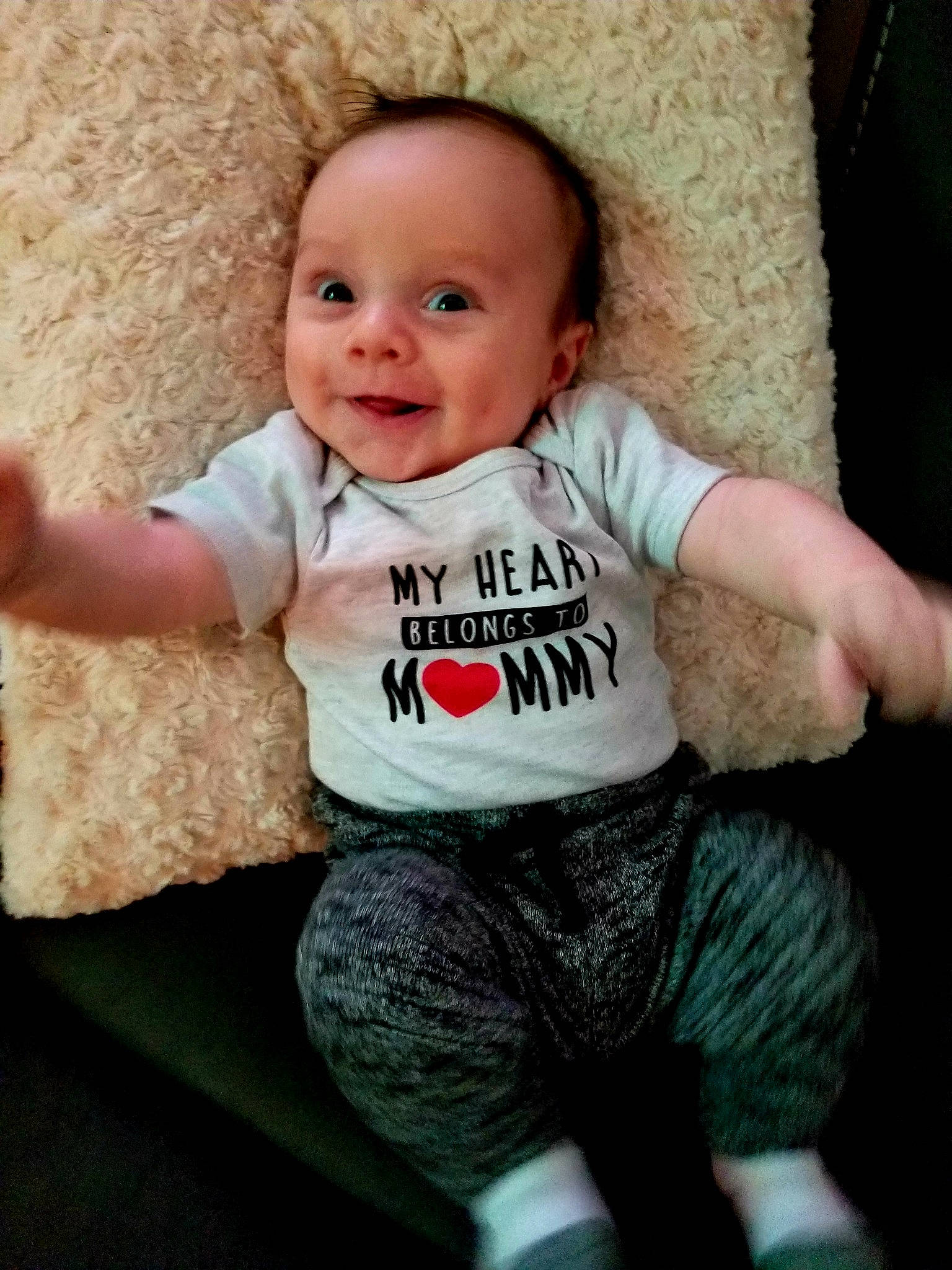 Giovani is registered to the contest to win money with this photo: arm, baby, baby_laughing, baby_products, baby_toddler_clothing, cheek, child, cool, nose, person, product, sitting, skin, sleeve, smile, t_shirt, toddler