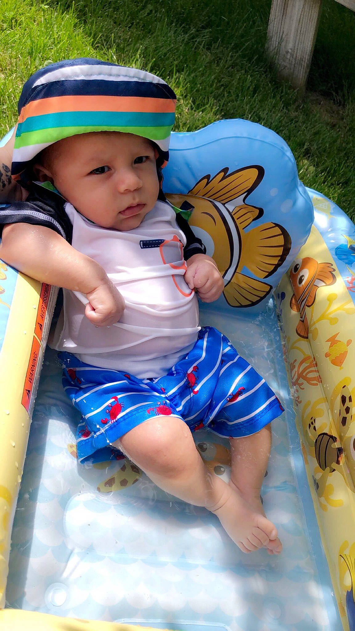 Emanuel is registered to the contest to win money with this photo: baby, child, fun, headwear, leg, person, play, smile, sun_hat, toddler, vacation