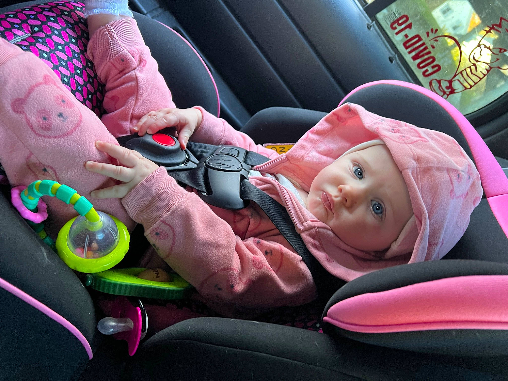 Gracelynn is registered to the contest to win money with this photo: auto_part, baby, baby_carriage, baby_in_car_seat, car_seat, child, comfort, facial_expression, finger, headwear, human_body, lap, motor_vehicle, people, person, pink, product, seat_belt, smile, steering_wheel