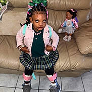 Tonlene Godqueen joined the competition — help win amazing prizes! child, girl, plaid_skirt, pink_jacket, hair_bows, bracelets, doll, leather_couch, tile_floor, sneakers, black_tights, indoor, person, portrait, fashion, accessories, confident, toy, home, seated_doll