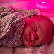 Arabella is registered to the contest to win money with this photo: baby, newborn, sleeping, blanket, cozy, face, infant, soft_light, pink_light, peaceful, portrait, indoor, resting, child, cute, human, wrapped, nursery, comfort, calm