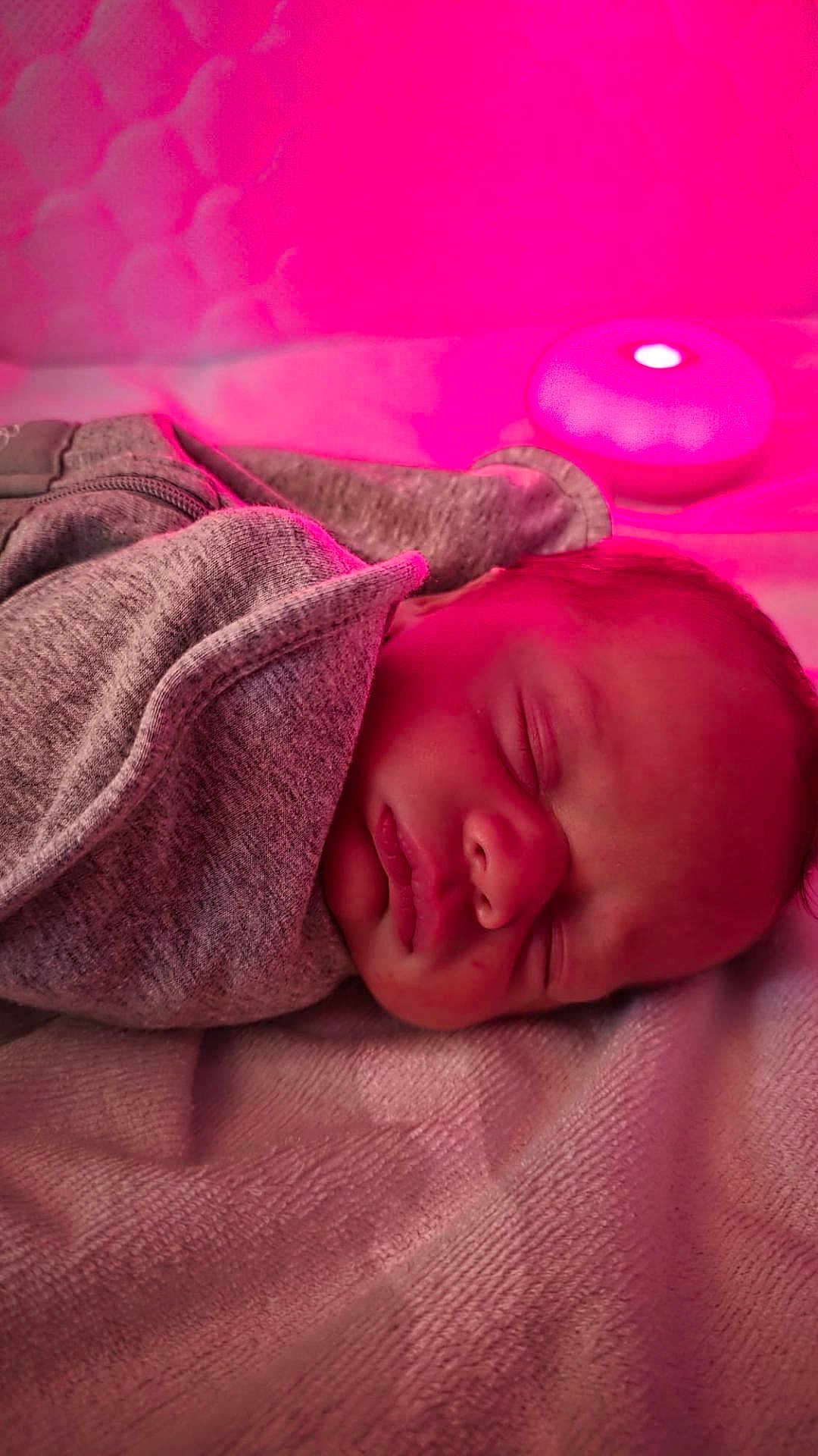 Arabella is registered to the contest to win money with this photo: baby, newborn, sleeping, blanket, cozy, face, infant, soft_light, pink_light, peaceful, portrait, indoor, resting, child, cute, human, wrapped, nursery, comfort, calm