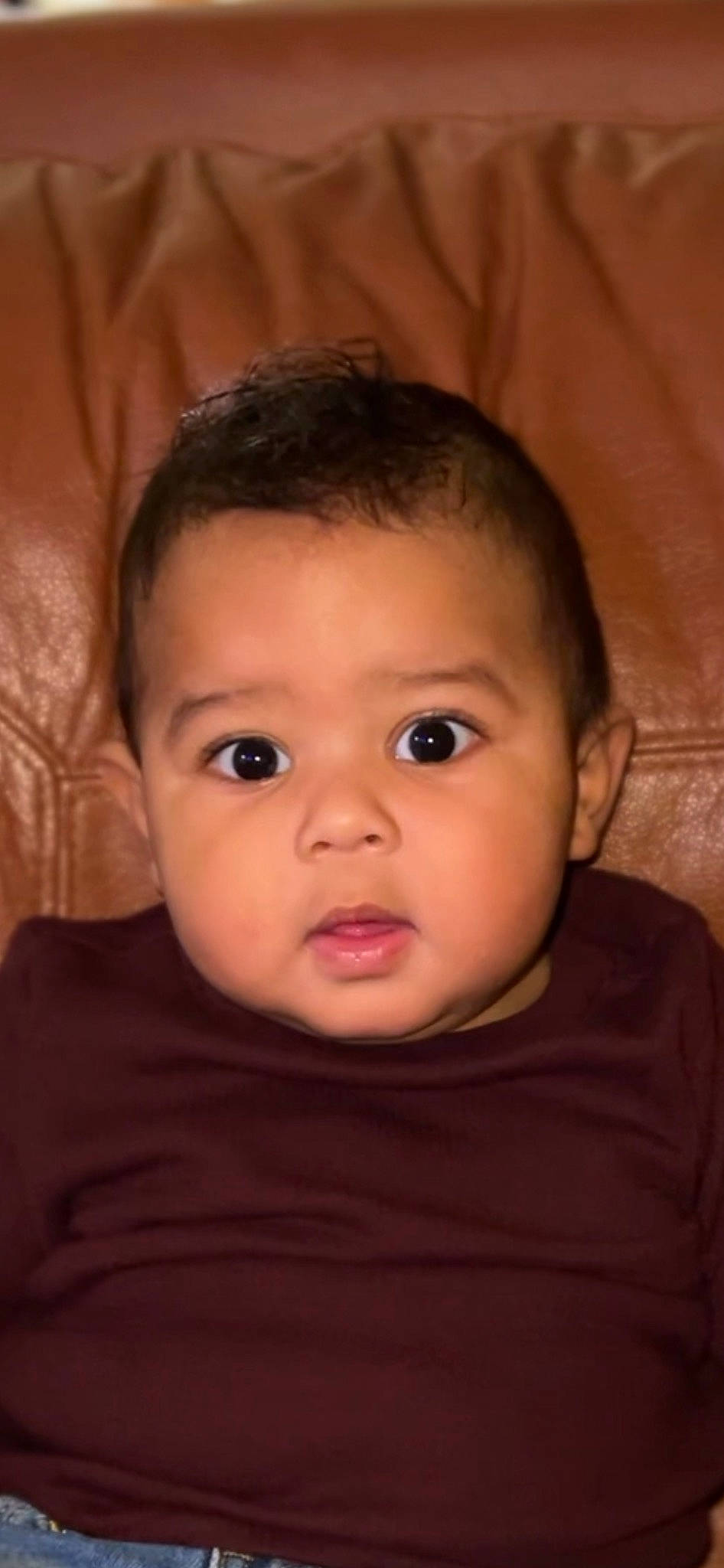 Kashton is registered to the contest to win money with this photo: baby, cheek, ear, eyebrow, eyelash, flash_photography, forehead, human_body, iris, jaw, lip, mouth, neck, no_expression, nose, person, skin, sleeve, smile, toddler