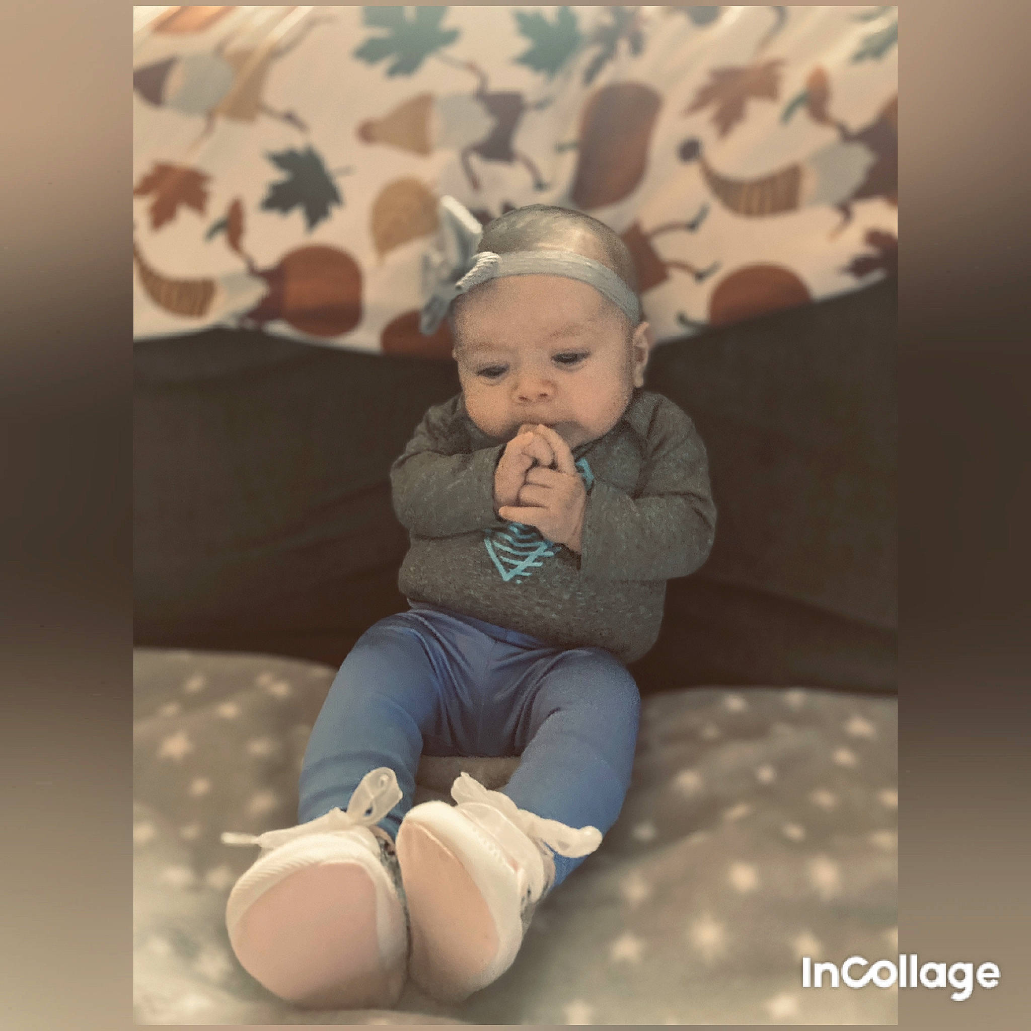 Paisley Ray is registered to the contest to win money with this photo: baby, baby_toddler_clothing, comfort, eye, flash_photography, flooring, foot, happy, headwear, human_leg, knee, leg, lighting, pattern, person, sitting, sleeve, sock, t_shirt, thigh