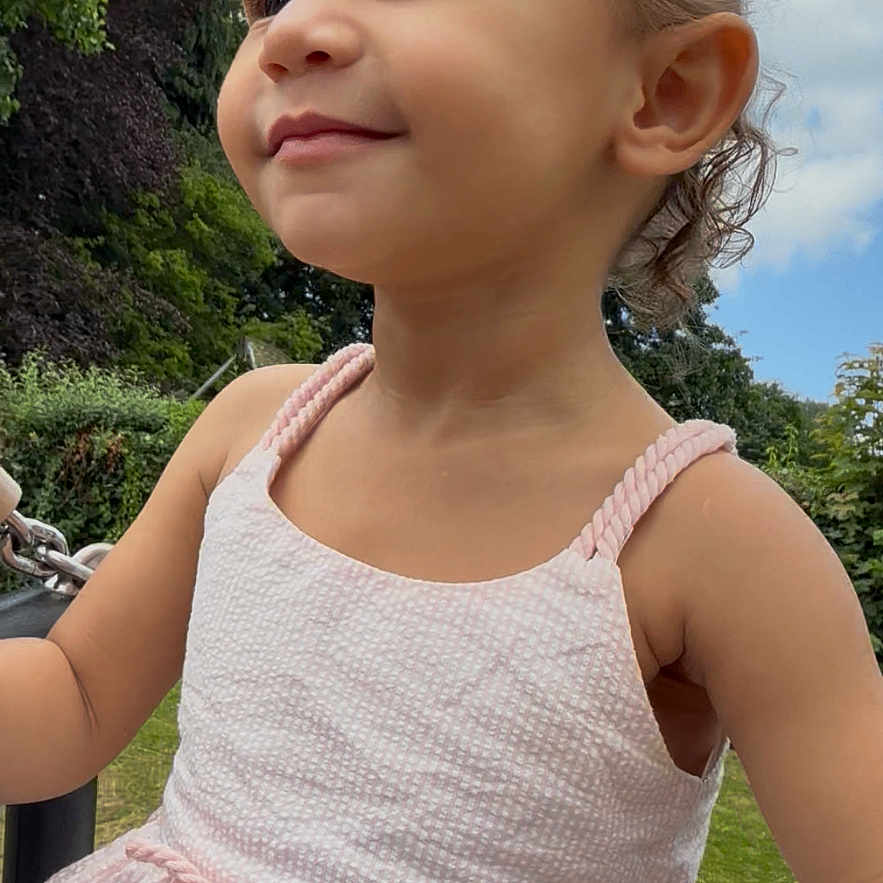 Anneliese joined the competition — help win amazing prizes! casual, child, clouds, cute, daylight, girl, greenery, happy, nature, outdoor, park, pink_dress, play, portrait, sky, smile, summer, swing, toddler, young_child