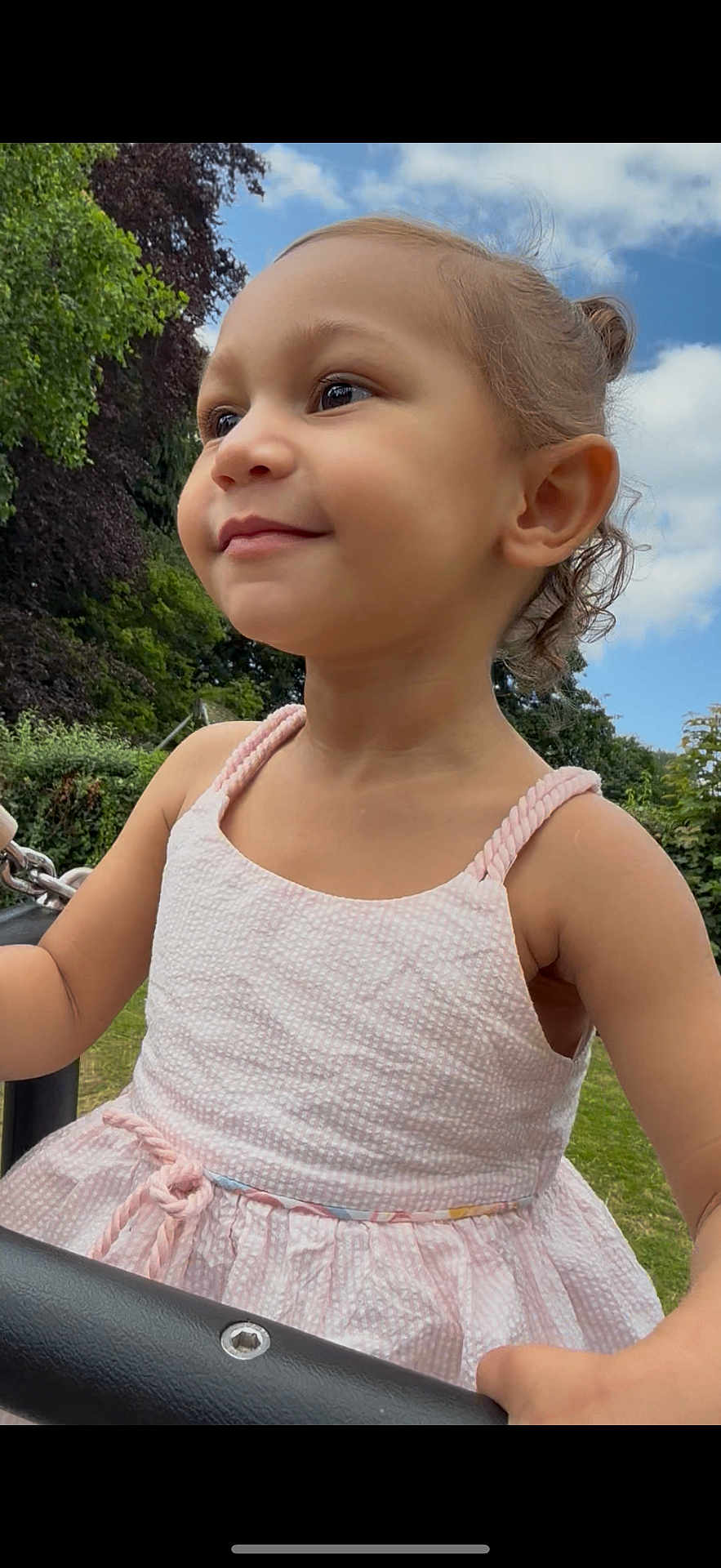Anneliese joined the competition — help win amazing prizes! toddler, child, girl, pink_dress, outdoor, park, swing, smile, happy, nature, greenery, sky, clouds, summer, play, cute, portrait, young_child, daylight, casual