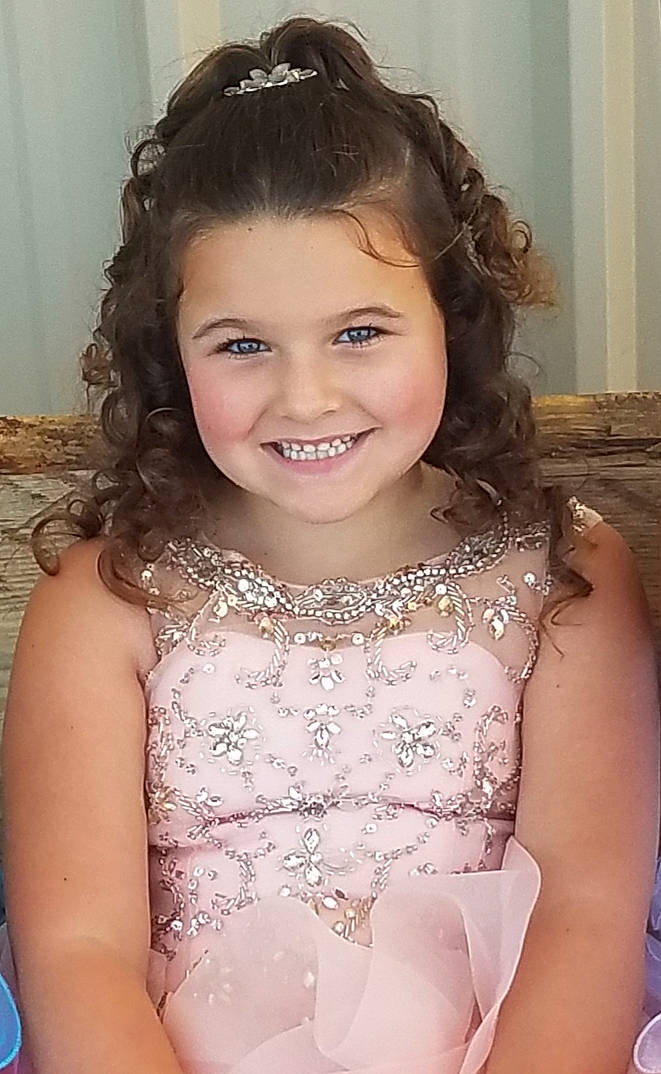 Makayli joined the competition — help win amazing prizes! bridal_accessory, brown_hair, child, child_model, clothing, dress, eyebrow, fashion_accessory, forehead, hair, hair_accessory, hairstyle, headpiece, iris, joy, lace, lip, long_hair, person, smile