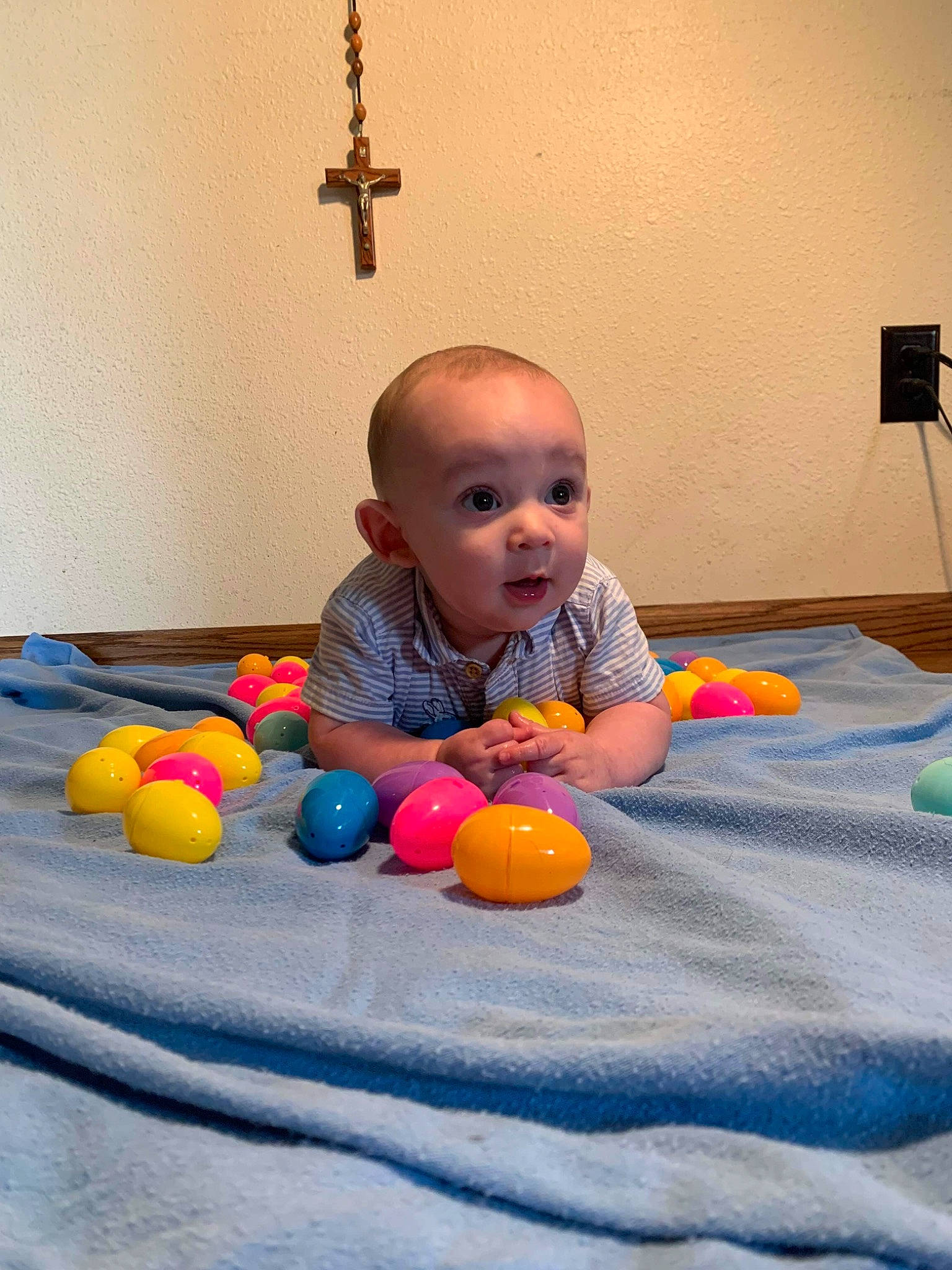 Ezra is registered to the contest to win money with this photo: baby, baby_playing_with_toys, baby_products, ball, child, floor, flooring, fun, hardwood, head, indoor_games_and_sports, leisure, orange, person, recreation, sitting, skin, surprise, table, toddler