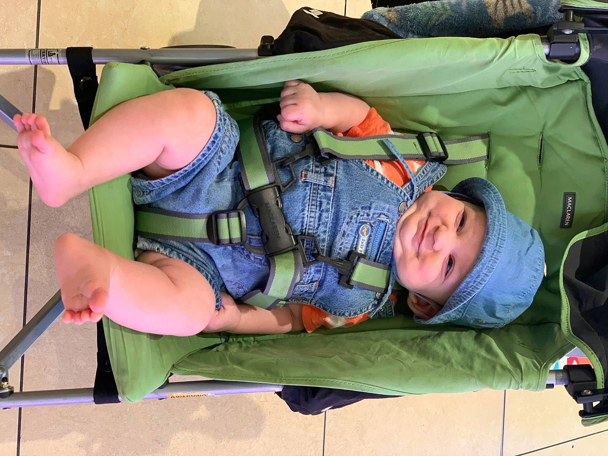 Ezra joined the competition — help win amazing prizes! baby, baby_products, bag, child, comfort, elbow, fun, grass, green, headwear, joint, joy, knee, lap, leisure, person, recreation, shorts, sitting, smile
