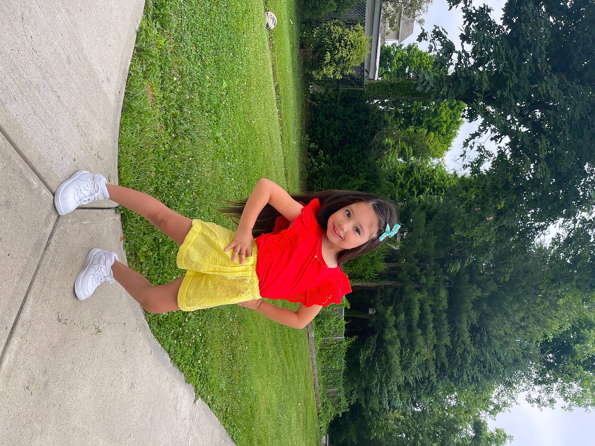 Ariana joined the competition — help win amazing prizes! chair, elbow, fun, grass, happy, human_leg, joy, knee, leisure, line, people_in_nature, person, plant, recreation, sandal, shorts, shrub, t_shirt, thigh, tree