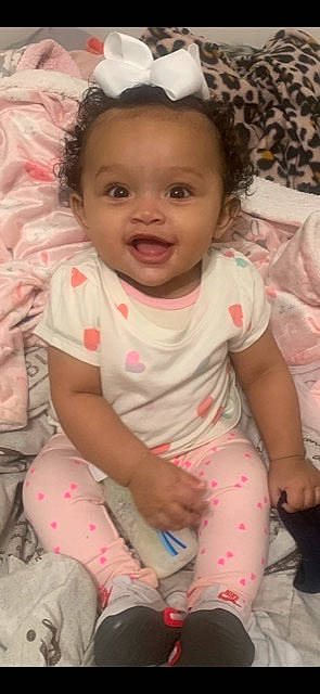 Aaniyah joined the competition — help win amazing prizes! arm, baby_toddler_clothing, cheek, chin, eye, eyebrow, face, hand, head, human_body, lip, mouth, neck, nose, organ, person, skin, sleeve, smile, textile