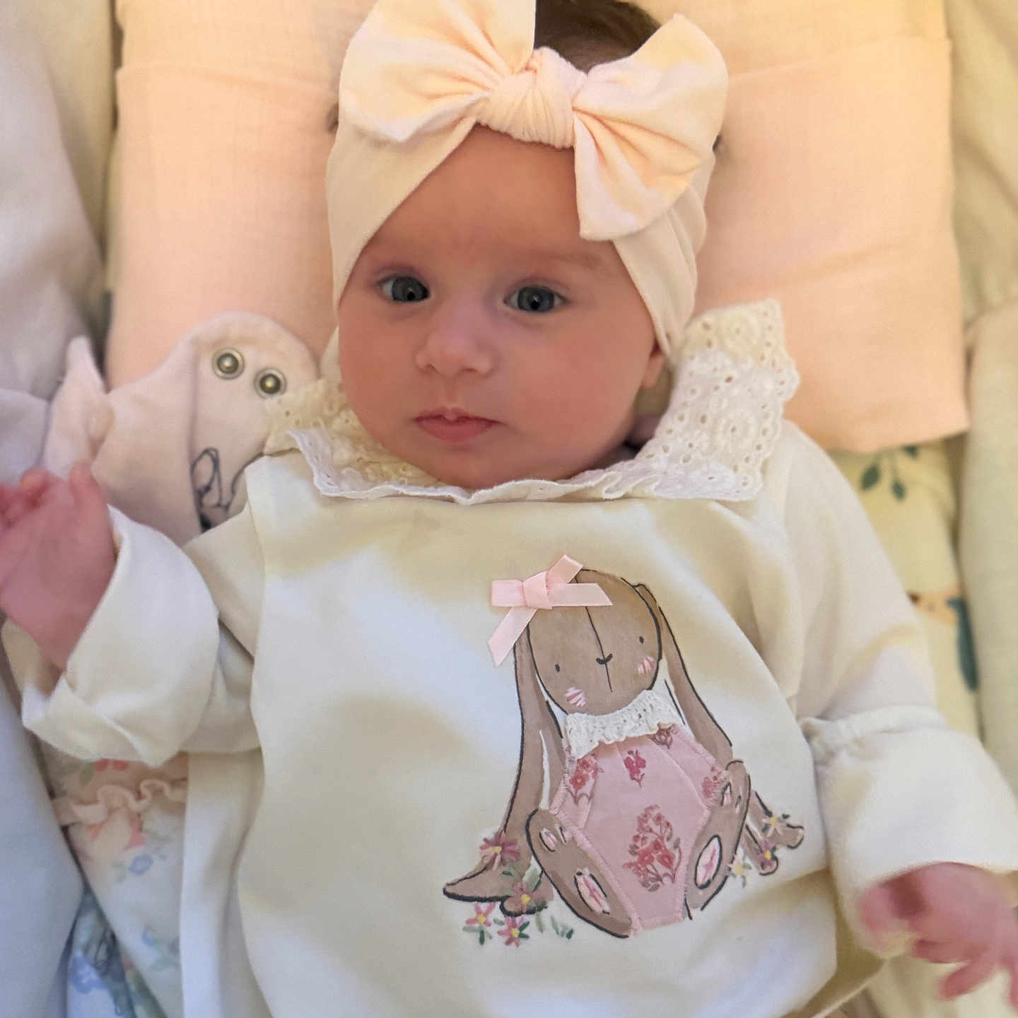 Melina joined the competition — help win amazing prizes! baby, blanket, bow, bunny, child, clothing, comfort, cute, expression, face, headband, illustration, indoors, infant, lying_down, pastel, portrait, sleepwear, soft, young