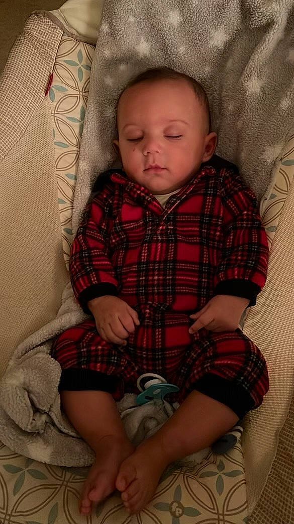 Kaiden is registered to the contest to win money with this photo: baby, baby_toddler_clothing, cheek, child, collar, comfort, dress_shirt, lap, linens, pattern, person, plaid, shorts, sitting, skin, sleeve, sock, tartan, textile, thigh