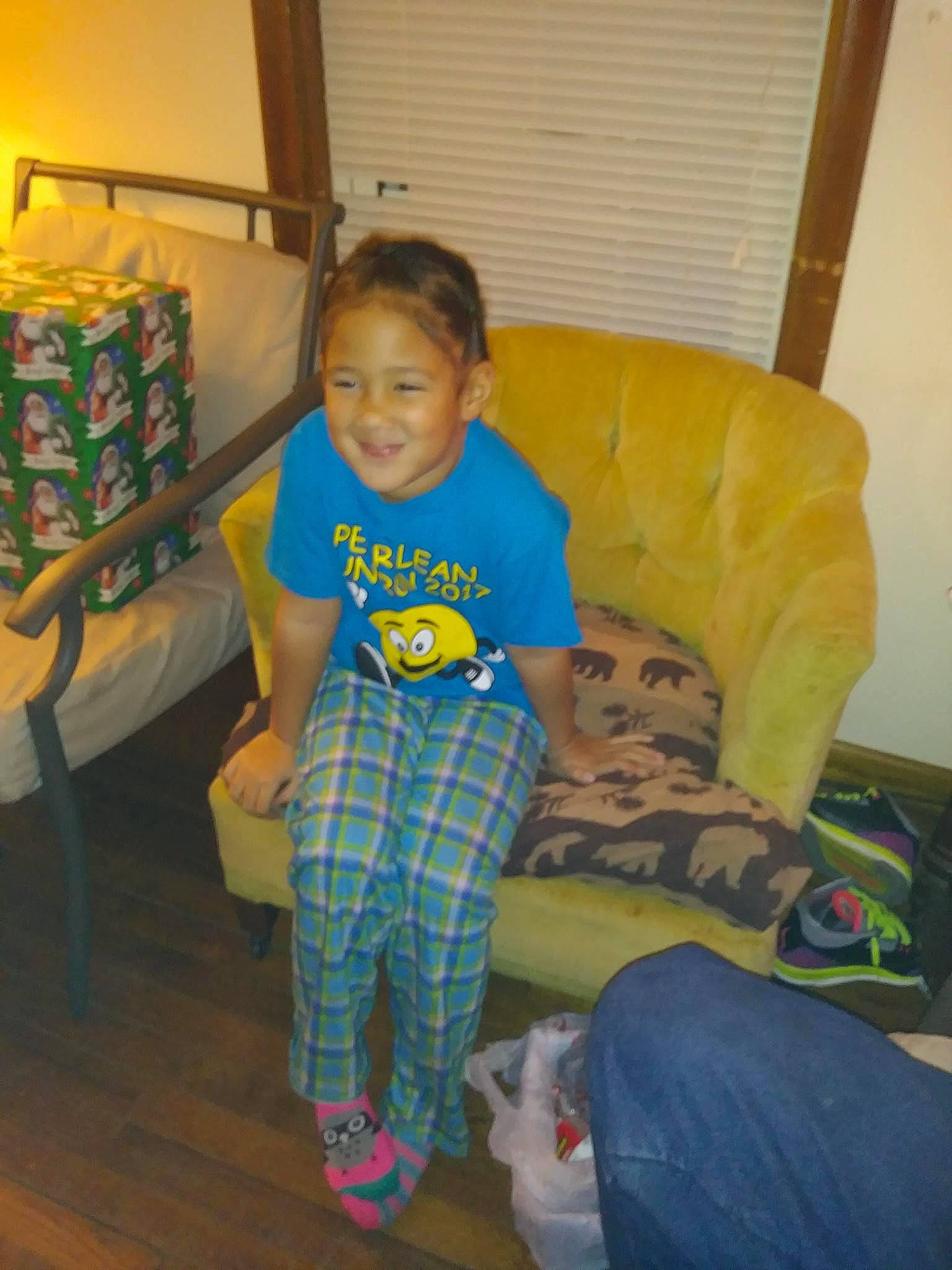 Arianna joined the competition — help win amazing prizes! child, comfort, couch, flooring, fun, hairstyle, happy, head, jeans, joy, leisure, living_room, organ, person, product, room, sitting, smile, t_shirt, thigh