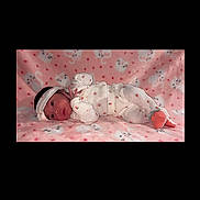 Ailany is registered to the contest to win money with this photo: adorable, baby, cat_pattern, child, cozy, cute, headband, heart_pattern, indoors, infant, lying_down, newborn, pink_blanket, portrait, resting, sleepy_cats, small_hands, soft_texture, strawberry_print, white_outfit