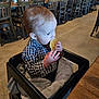 Colton joined the competition — help win amazing prizes! baby, blanket, casual_clothing, checkered_shirt, child, cozy, cute, dining, eating, family, food, high_chair, indoor, pancake, person, restaurant, seat, table, toddler, wooden_chair
